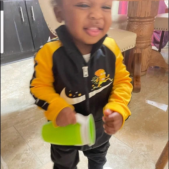 Black and gold nike jumpsuit hotsell